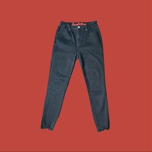 high-rise slim-fit black skinny jeans with raw hem